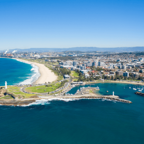 Wollongong coastline with beach and lighthouse, representing photobooth hire services in Wollongong.